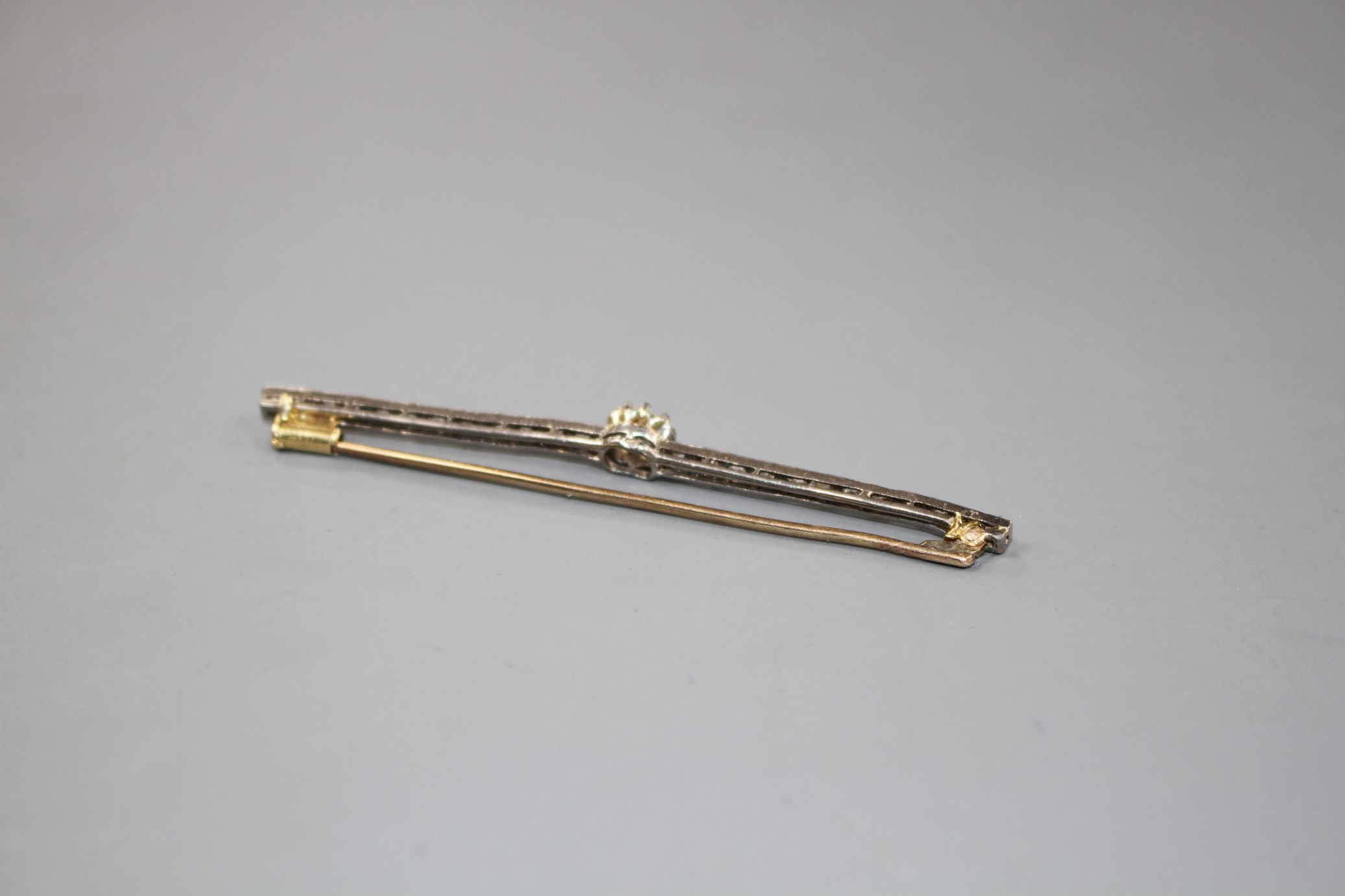 A 1920's yellow and white metal, diamond bar brooch, with central old cut diamond and millegrain set - Image 4 of 4