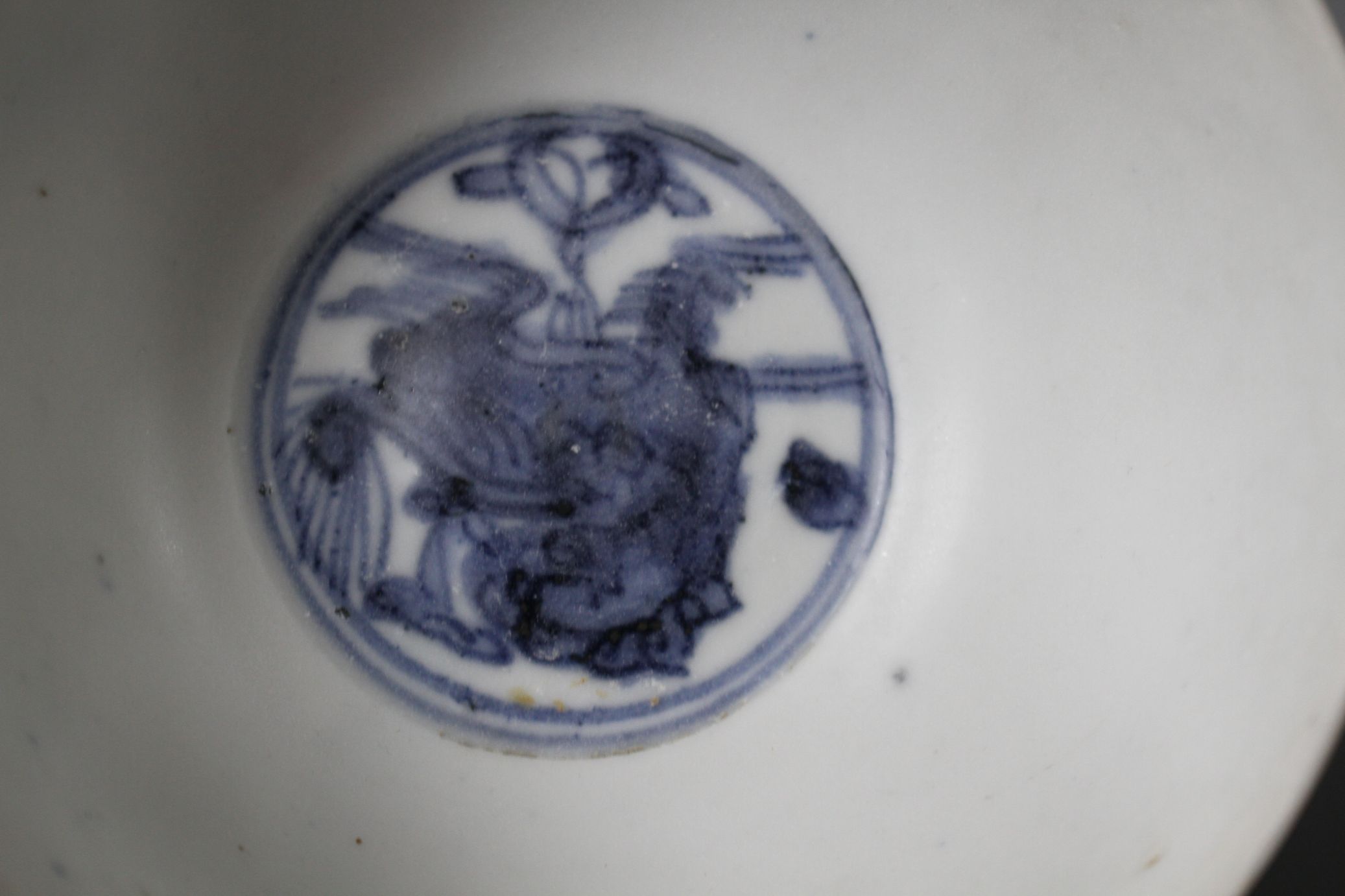 Two Chinese Ming blue and white bowls, Zhangzhou kilns, each painted with a lion-dog to the - Image 5 of 7