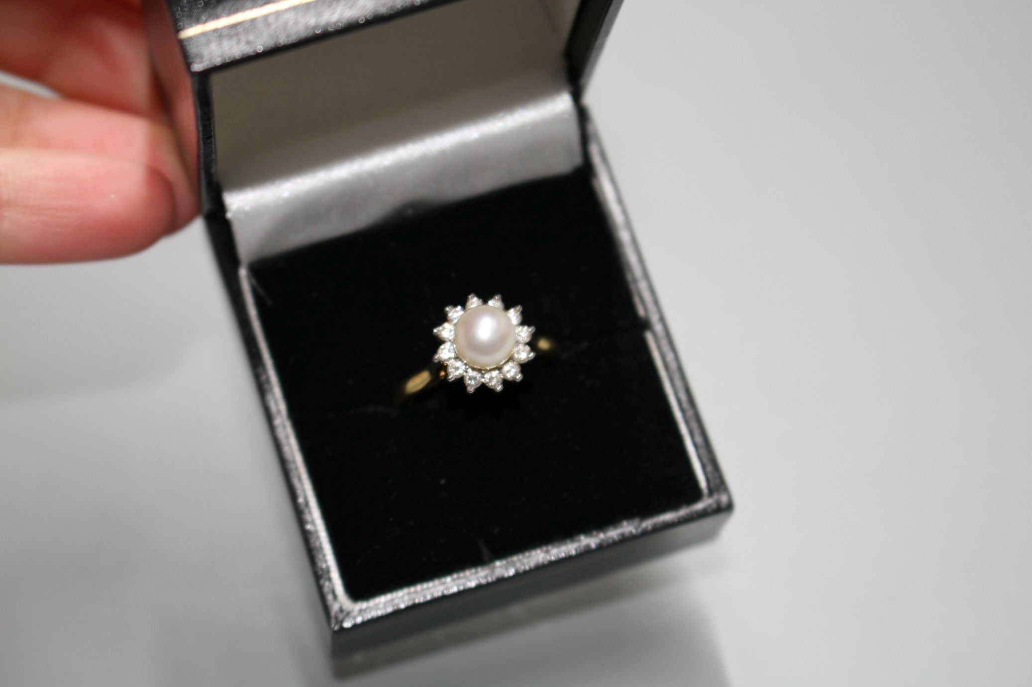 A modern 18ct gold, cultured pearl and diamond cluster set flower head ring, gross 4.4. grams. - Image 2 of 6