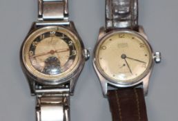 A gentleman's 1950's? steel Dixton manual wind wrist watch and a Rodana manual wind wrist watch.