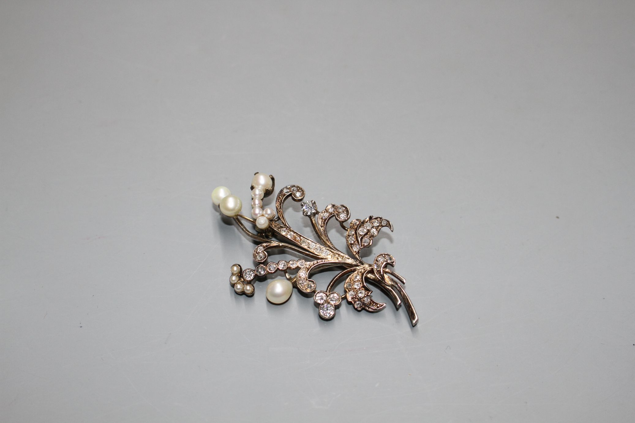 An early-mid 20th century yellow metal, cultured pearl and diamond set floral spray brooch, 62mm, - Image 2 of 3