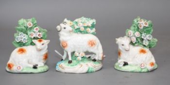 Three Derby figures of two rams and a ewe, late 18th century, each standing before bocage, patch