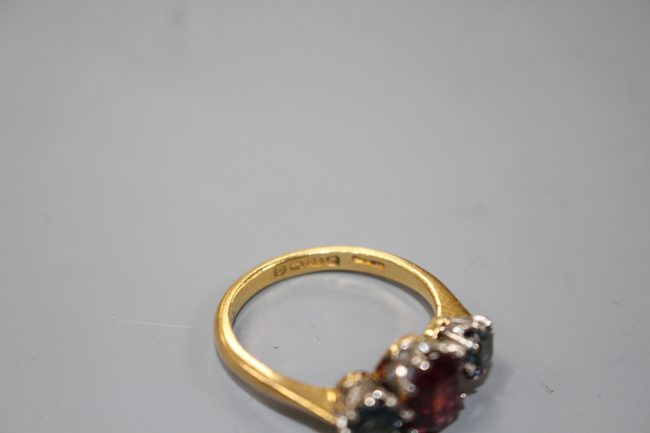 A 1930's 22ct gold, garnet and sapphire? three stone dress ring, size P/Q, gross 5 grams. - Image 3 of 4