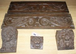 Three 19th century Continental carved oak corbels, carved with lion masks and a pair of scroll and