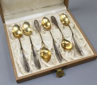 A cased set of early 20th century German parcel gilt 800 white metal coffee spoons, by Carl
