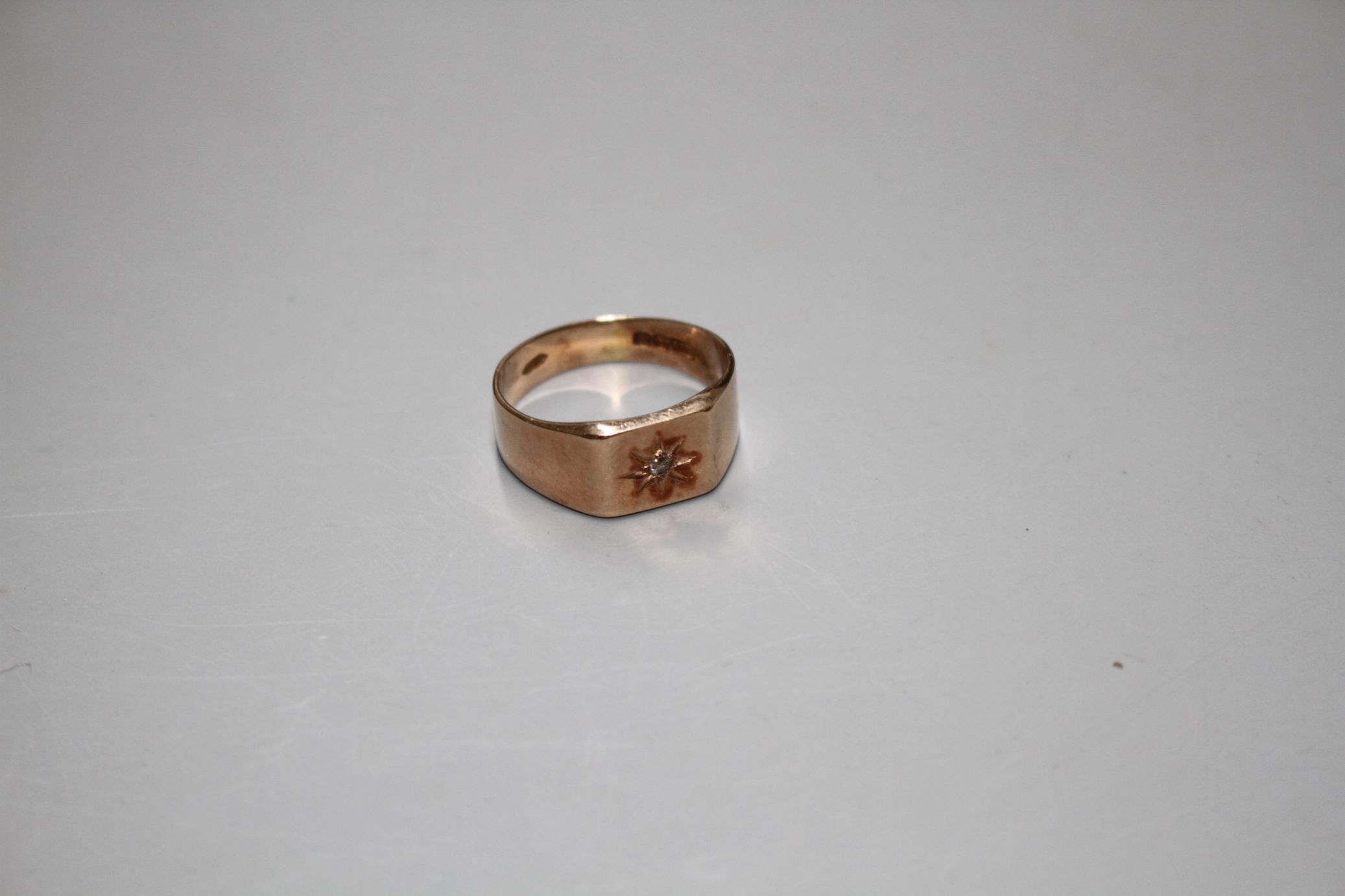 A George V 9ct gold and diamond chip set signet ring, Birmingham, 1929, size R/S, gross 5.3 grams. - Image 2 of 5