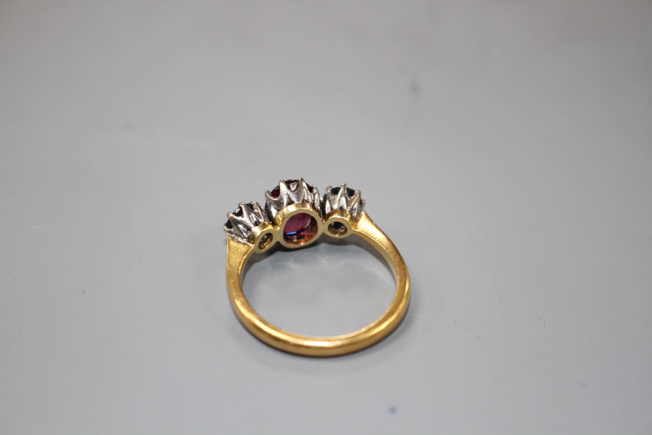 A 1930's 22ct gold, garnet and sapphire? three stone dress ring, size P/Q, gross 5 grams. - Image 4 of 4