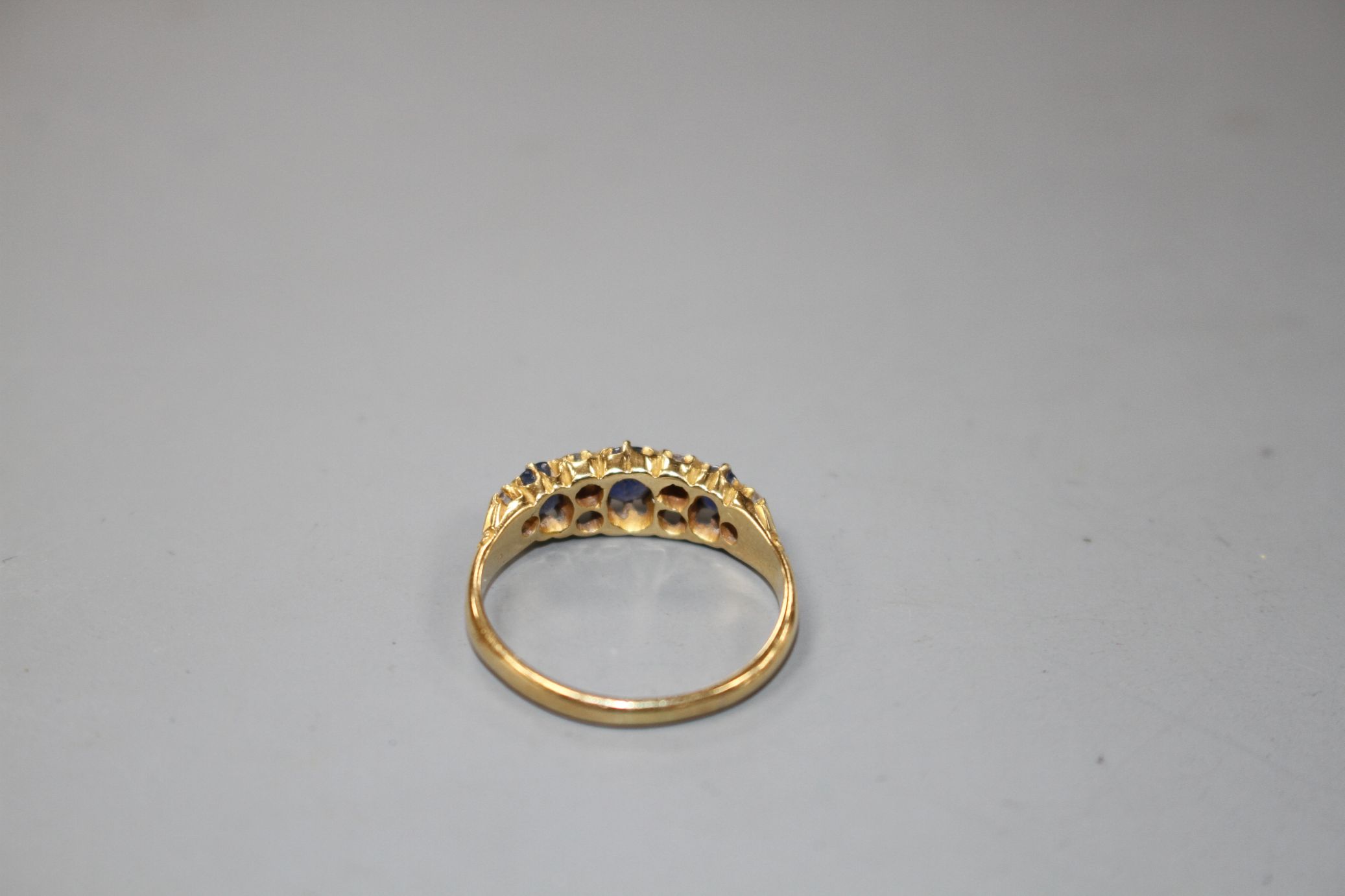 A George V 18ct gold, three stone sapphire and six stone diamond set half hoop ring, size M, gross - Image 3 of 5