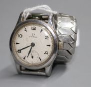 A gentleman's early 1940's stainless steel mid-size Omega manual wind wrist watch, on associated