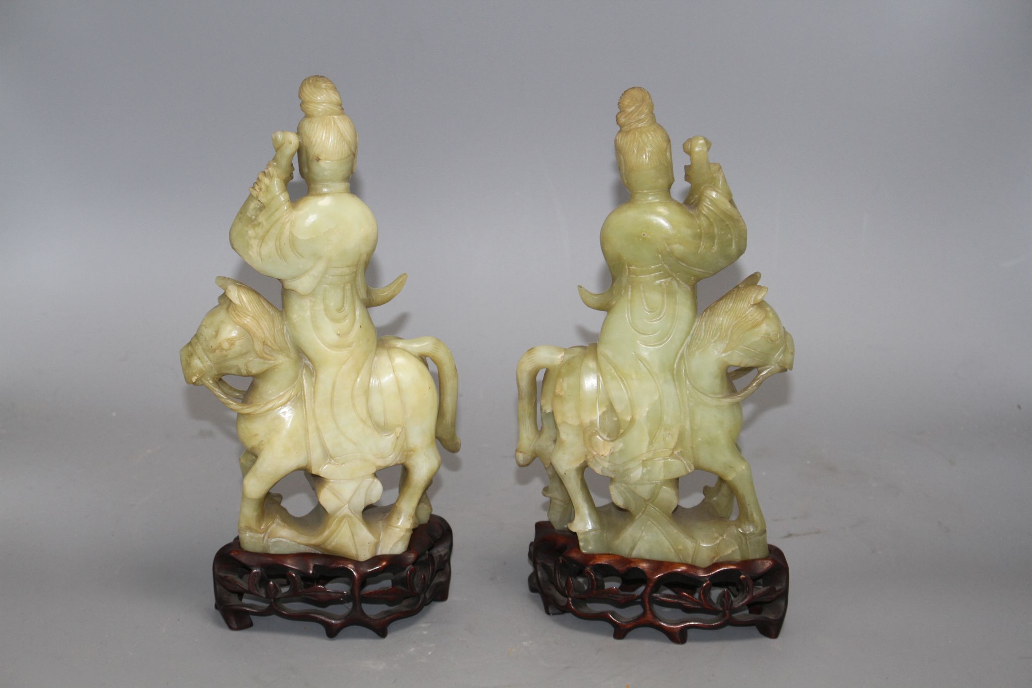 A pair of Chinese bowenite jade groups of a lady riding a horse, wood stands natural inclusions - Image 3 of 9