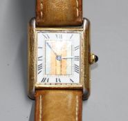 A lady's 925 gilt Must de Cartier Vermeil Tank quartz wrist watch, on associated strap. Condition: