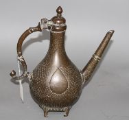 A late 18th century Mughal brass ewer Condition: Wear to the engraving commensurate with age