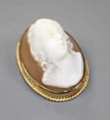 A modern 9ct gold mounted oval cameo brooch, carved with the bust of a lady to sinister, gross 11.
