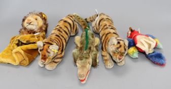 Two 1950's Steiff tigers, a crocodile, a parrot and a lion glove puppet Condition:- first tiger -