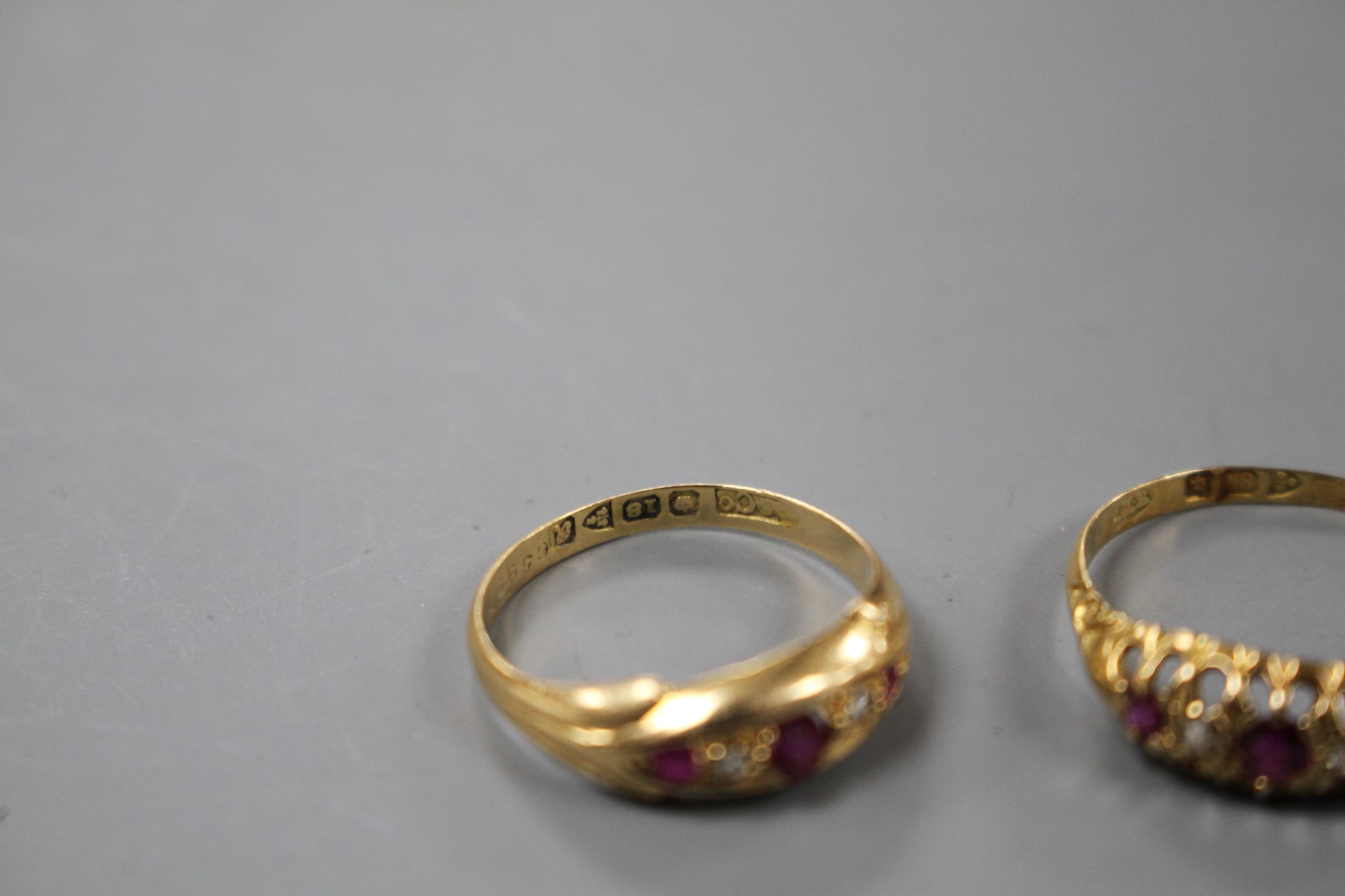 Two early 20th century 18ct gold, ruby and diamond set dress rings, sizes- N(3 stone) and R. Gross - Image 3 of 5