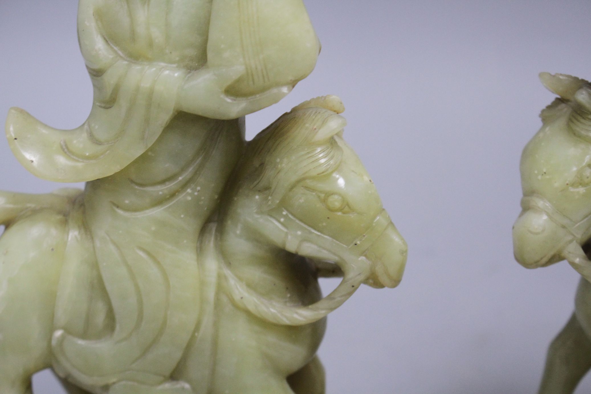 A pair of Chinese bowenite jade groups of a lady riding a horse, wood stands natural inclusions - Image 8 of 9