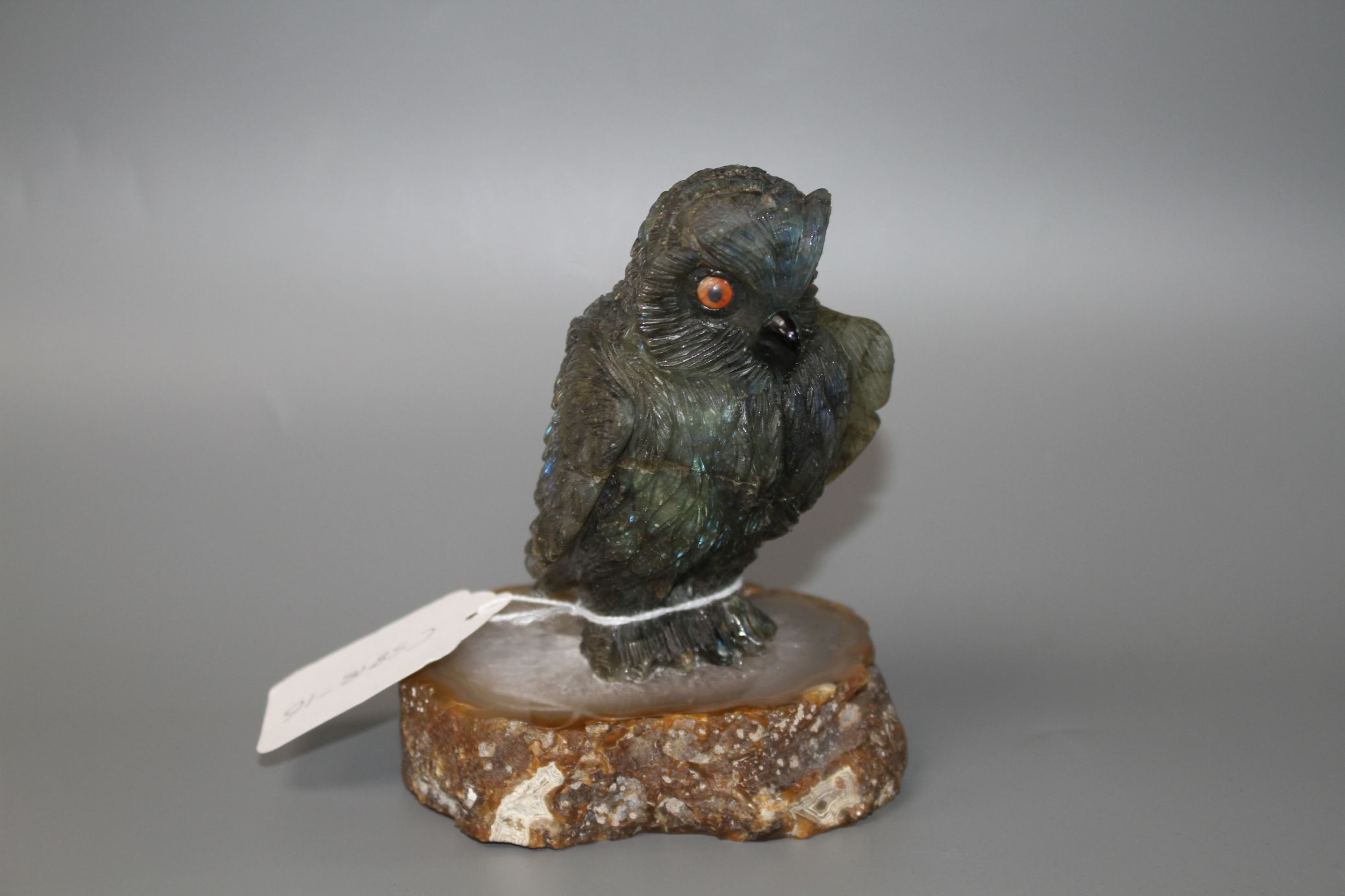 A carved labradorite model of an owl on an agate base, height 12.8cm. Condition: Small flaws that - Image 4 of 4
