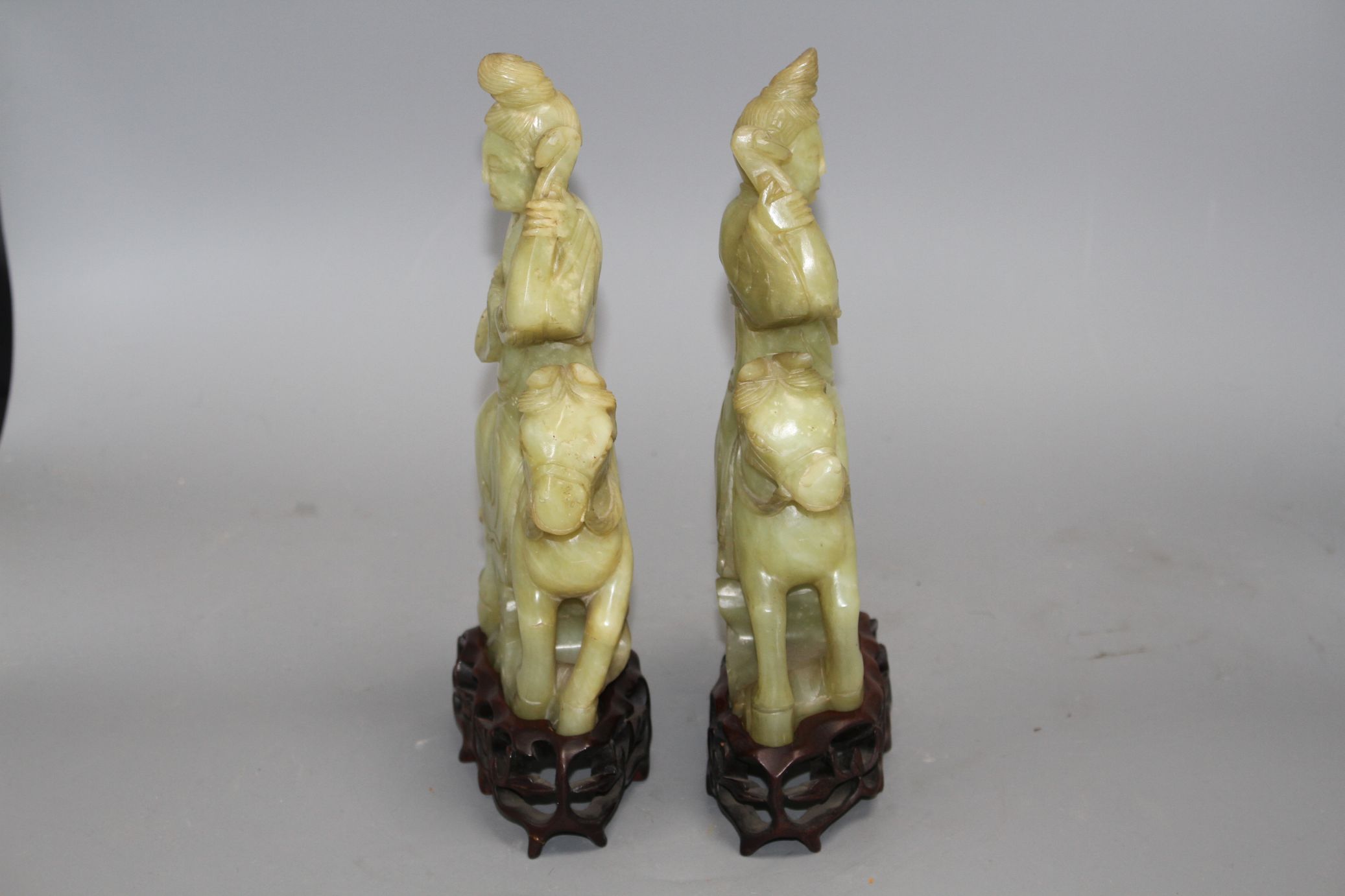 A pair of Chinese bowenite jade groups of a lady riding a horse, wood stands natural inclusions - Image 2 of 9