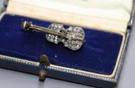 A late Victorian yellow and white metal and rose cut diamond set novelty brooch, modelled as a