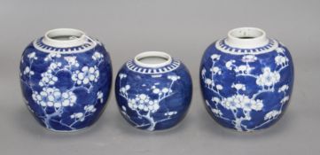 Three Chinese blue and white 'prunus' jars, early 20th century, typical minor glaze imperfections,