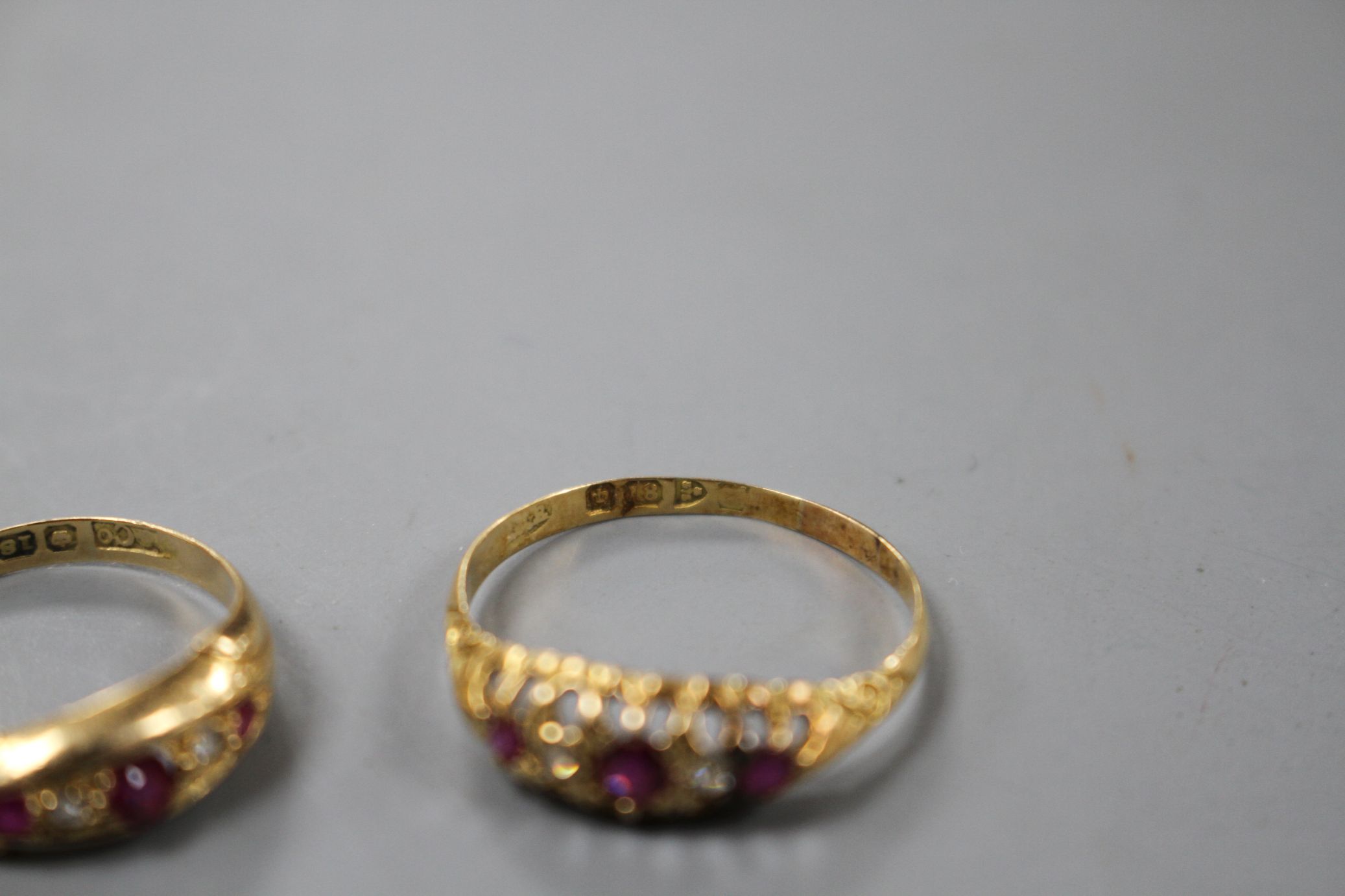 Two early 20th century 18ct gold, ruby and diamond set dress rings, sizes- N(3 stone) and R. Gross - Image 4 of 5