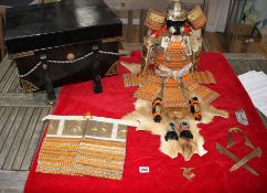 A Japanese late Meiji period suite of model Samurai armour, made from gilt and lacquered wood,