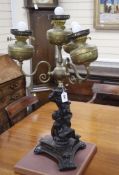 An Edwardian brass mounted bronzed spelter four light table lamp, c.1900, height 76cm Condition: