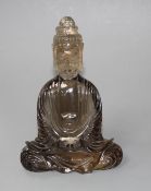 A Chinese smoky quartz seated figure of Guanyin, 19th/early 20th century, splinter inclusion to back