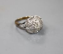 A 1960's 18ct gold and illusion set diamond cluster ring, size J, gross weight 4.6 grams.