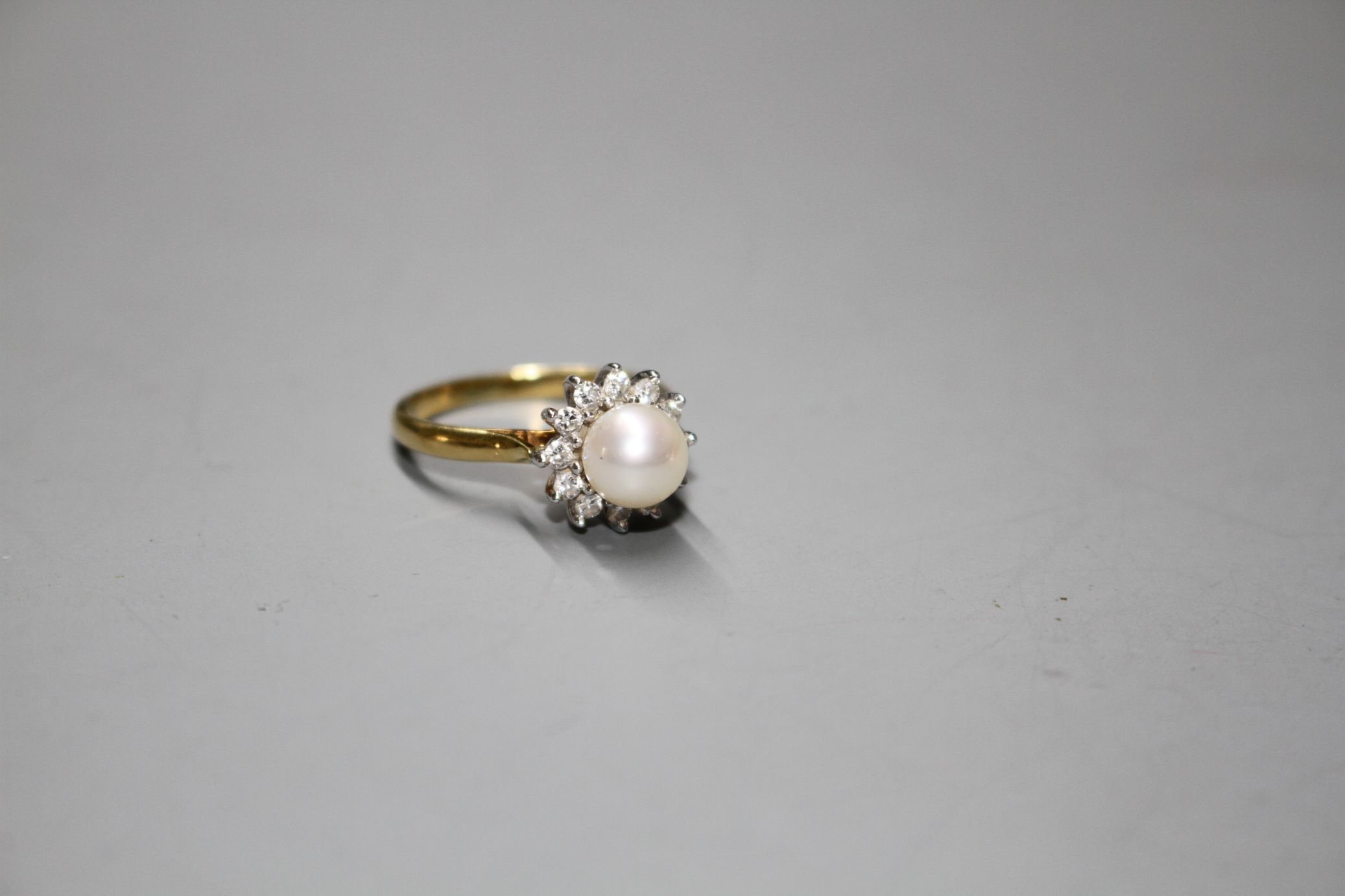 A modern 18ct gold, cultured pearl and diamond cluster set flower head ring, gross 4.4. grams. - Image 3 of 6