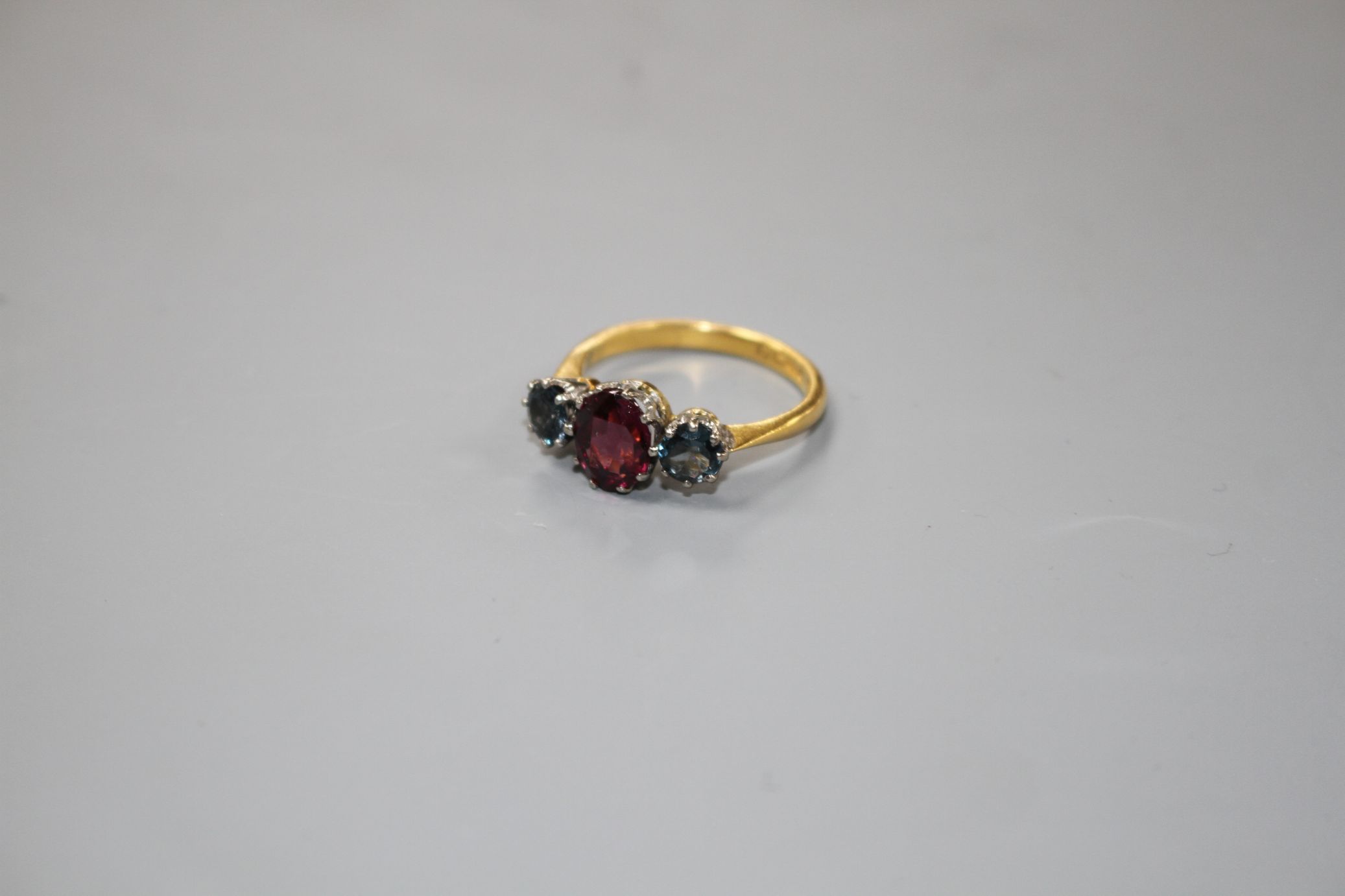 A 1930's 22ct gold, garnet and sapphire? three stone dress ring, size P/Q, gross 5 grams. - Image 2 of 4