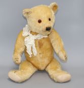 A Chiltern type bear, blond mohair, glass eyes, original pads, some slight staining on centre seam