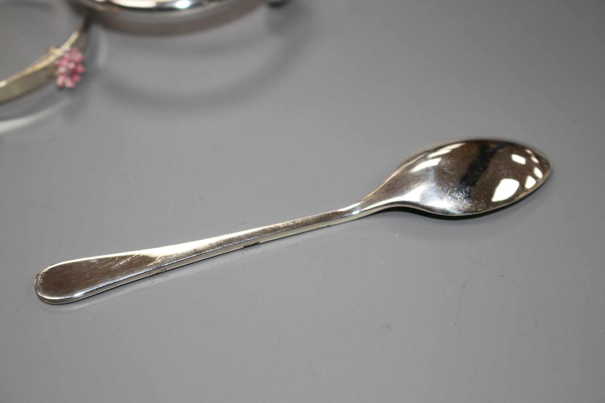 A modern silver coffee spoon and two 925 child's bangles, gross weight 31 grams. - Image 3 of 3