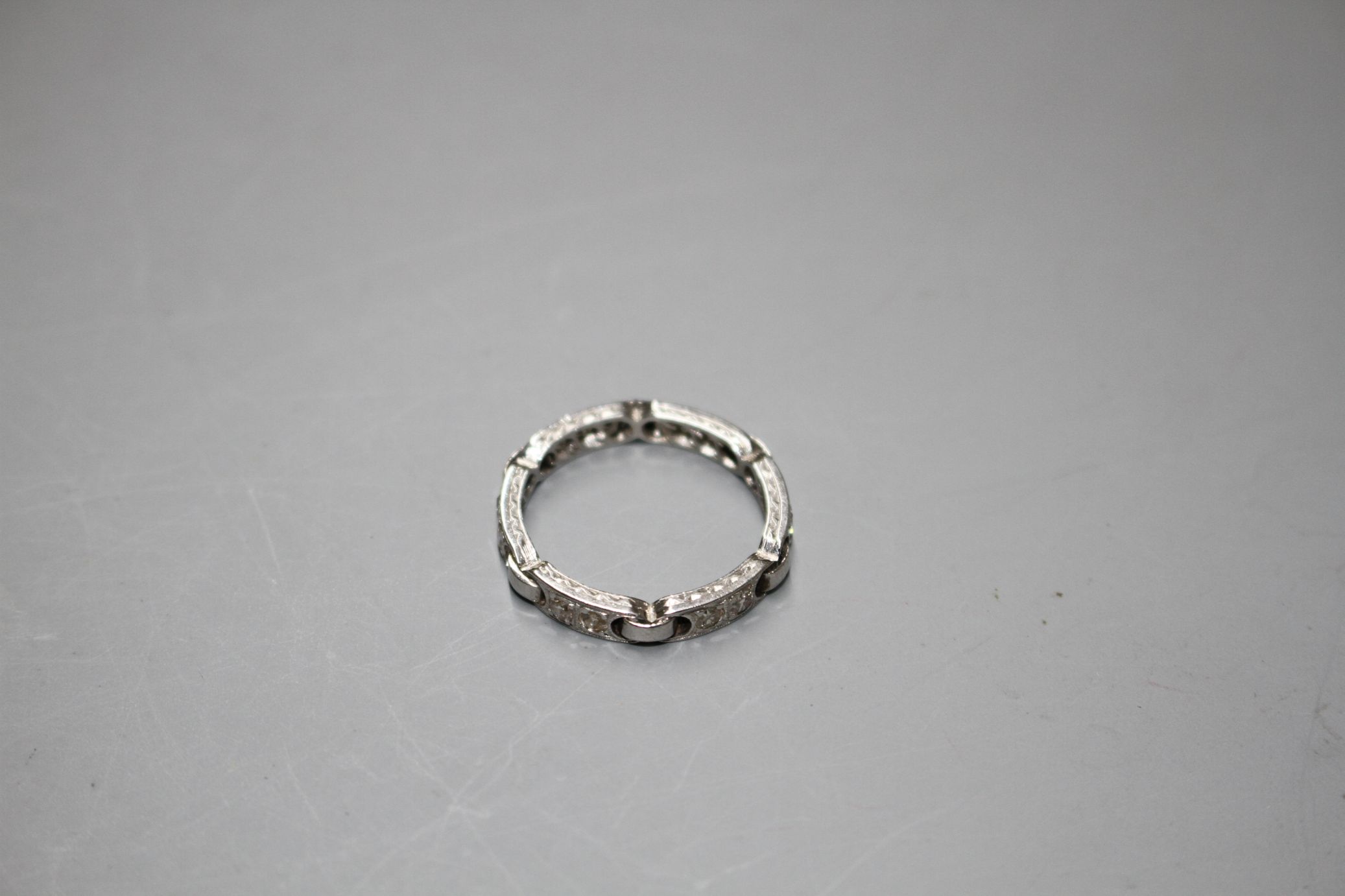 An unusual white metal (stamped Plat) and twelve stone diamond set eternity ring, with six 'chain' - Image 2 of 6