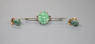 A 9ct white metal and carved oval jade plaque set bar brooch and a pair of 14k and simulated jade