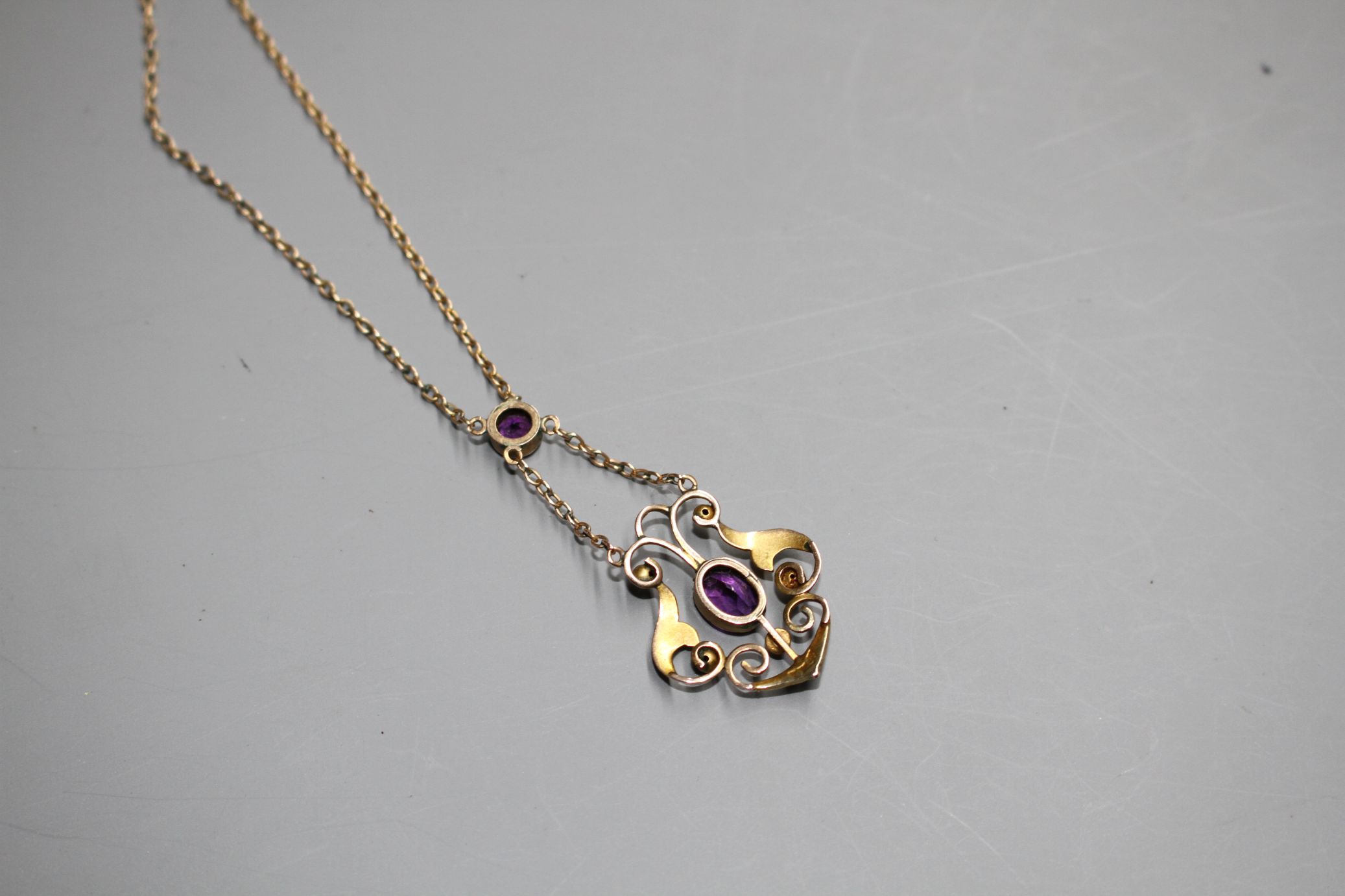 An Edwardian 9ct, amethyst and seed pearl set pendant necklace, pendant lower section 25mm. - Image 3 of 4