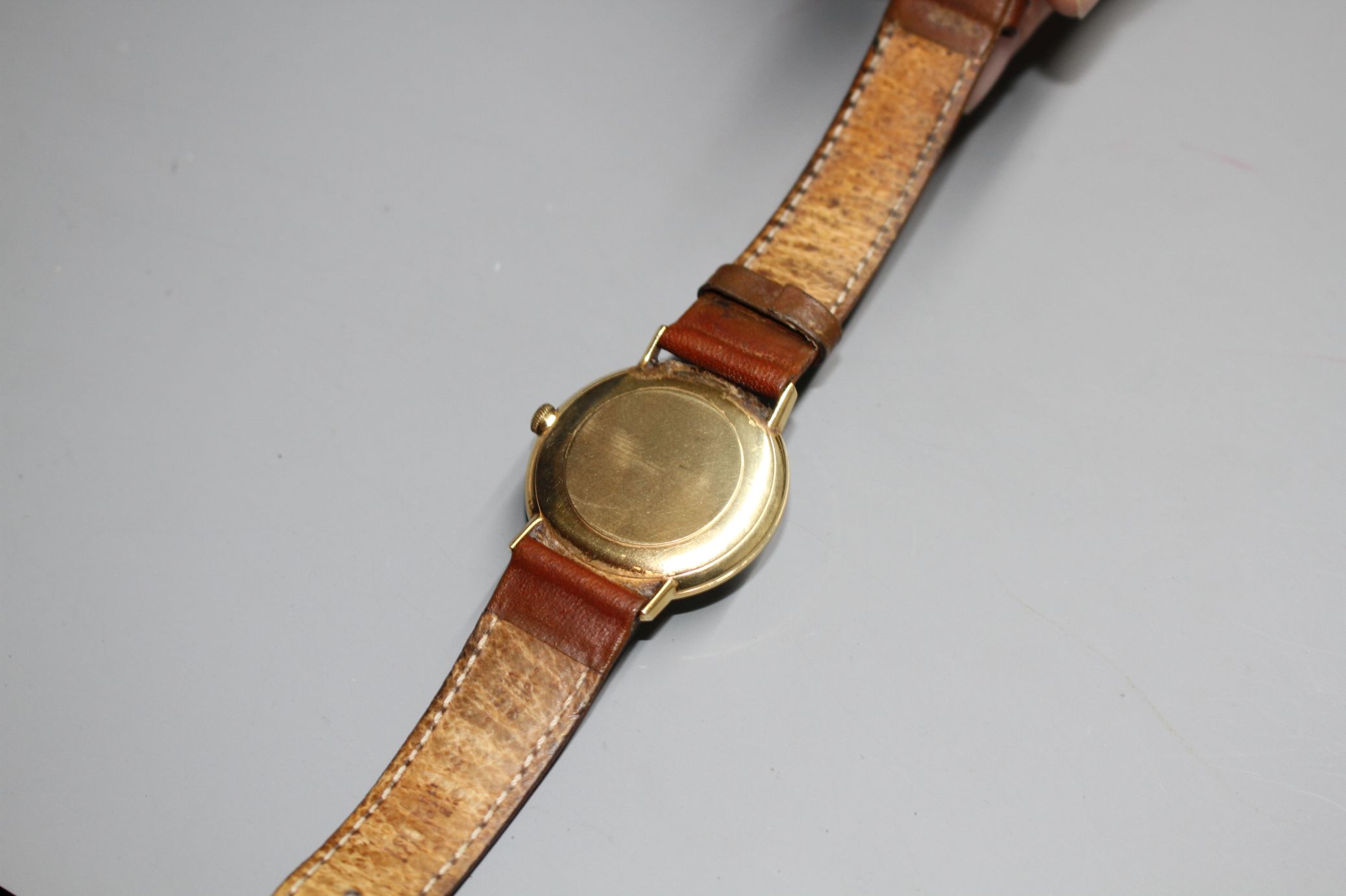 A gentleman's Omega manual wind wrist watch, on associated strap, with yellow metal? case.Condition: - Image 3 of 3