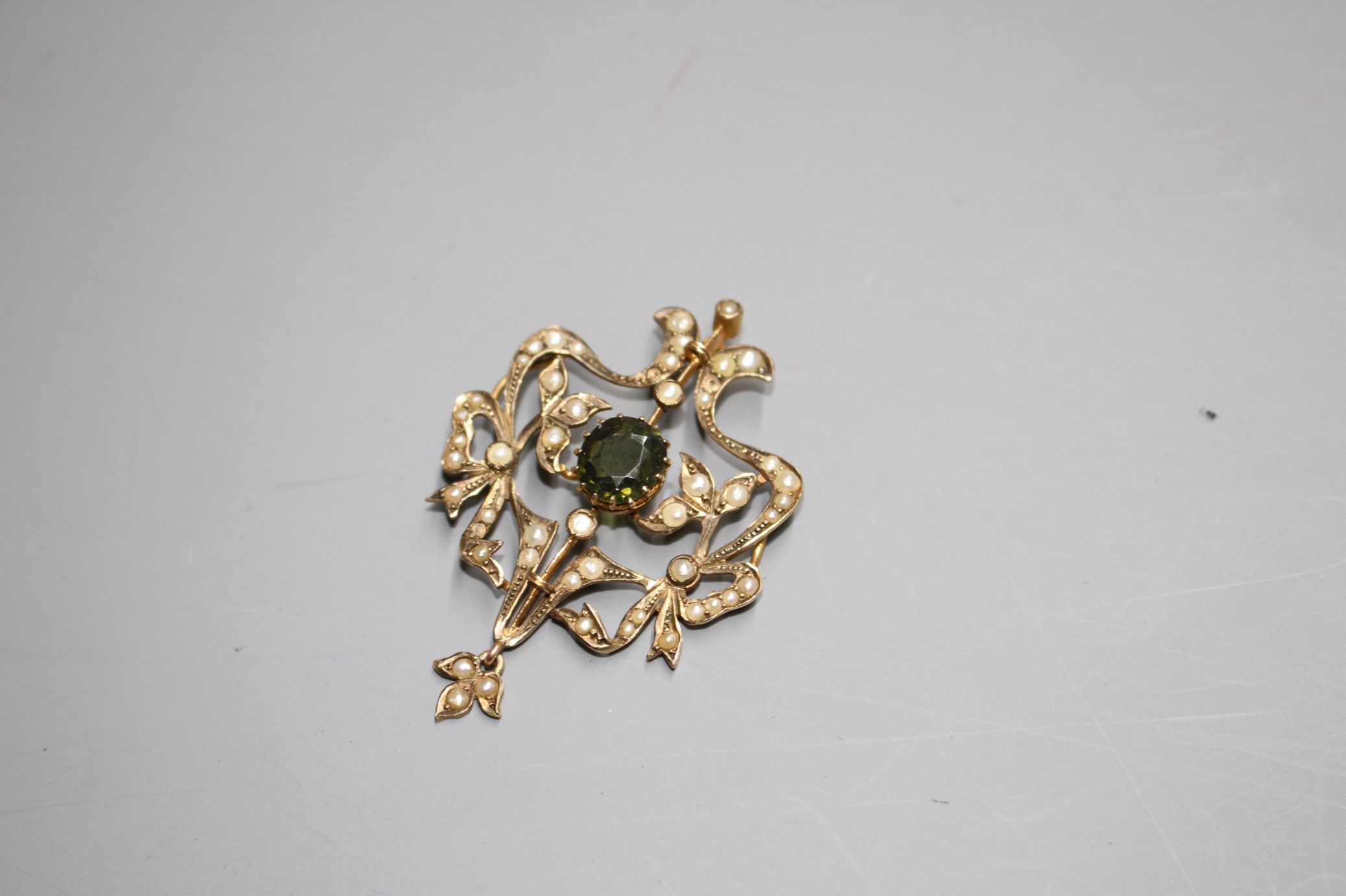 An Edwardian 9ct, green garnet and seed pearl set openwork scroll drop pendant, 47mm, gross 5.1 - Image 2 of 3