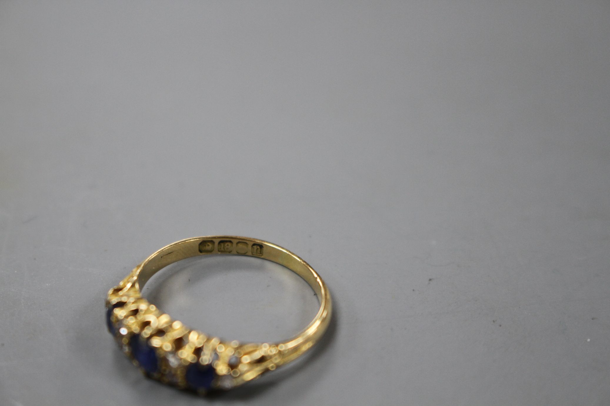 A George V 18ct gold, three stone sapphire and six stone diamond set half hoop ring, size M, gross - Image 5 of 5