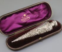 A late Victorian repousse silver mounted scent bottle, in Goldsmith & Silversmith box, by Horton and