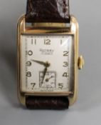 A gentleman's early 1950's 9ct gold Rotary manual wind wrist watch, the rectangular dial with Arabic