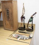 A Japanese late Meiji period set of lacquered model weapons on display stands, comprising archer's