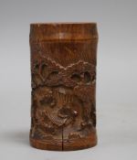 A Chinese bamboo brush pot, carved with scholars playing weiqi, late 19th/early 20th century some