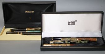 A group of fountain pens including a Pelikan Souveran, Mont Blanc, Onoto and a Watermans Ideal