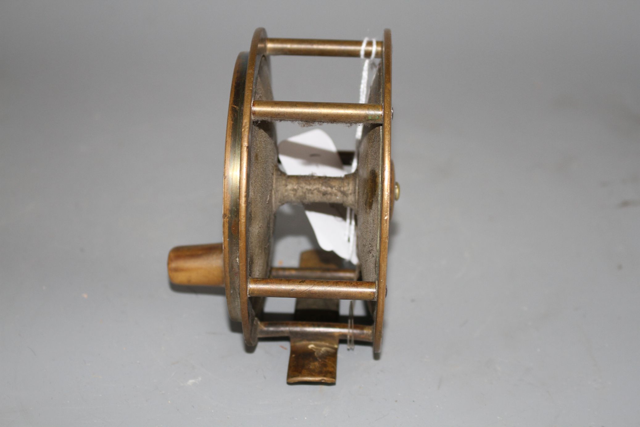 An early brass 4.5in. fishing reel by Army & Navy Cooperative Stores Ltd., engraved mark, diameter - Image 3 of 4