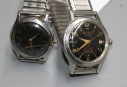 Two gentleman's stainless steel black dial wrist watches including automatic and Universal(a.f.).