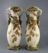 A pair of tall Royal Dux Art Nouveau two handled vases, early 20th century, each modelled with