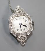 A lady's platinum and diamond set manual wind wrist watch (no strap) now with brooch fitting,