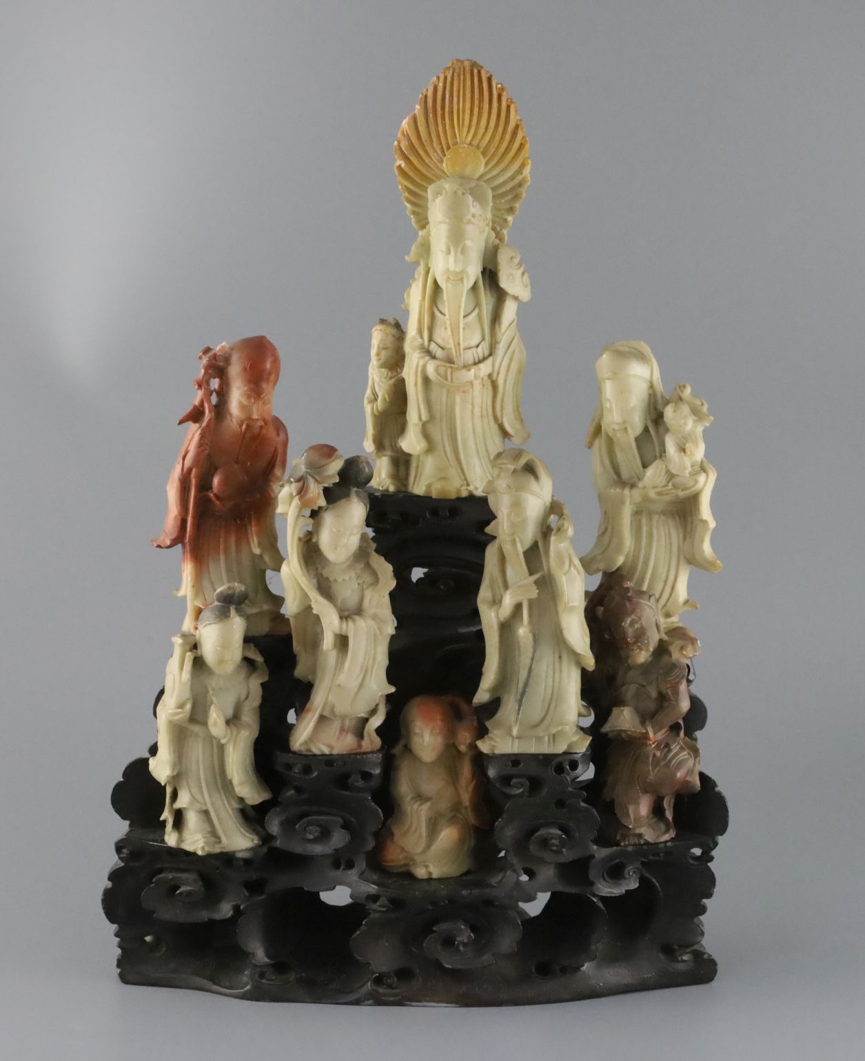 A Chinese soapstone group of eight immortals, late 19th / early 20th century, each separate figure