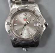 A gentleman's stainless steel Tag Heuer Professional quartz wrist watch, on steel Tag bracelet.